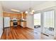 Open kitchen and dining area, with stainless steel appliances and sliding glass doors to the outside at 316 Society Dr, Indianapolis, IN 46229