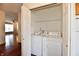 The laundry room features a full-size washer and dryer, conveniently located near other living spaces at 316 Society Dr, Indianapolis, IN 46229
