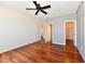 The main bedroom is spacious with a ceiling fan, wood floors, and an adjacent walk-in closet at 316 Society Dr, Indianapolis, IN 46229