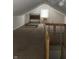 Cozy attic bedroom with window and carpet at 3355 Wallace Ave, Indianapolis, IN 46218