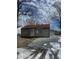 Charming single-story home with gravel yard and detached garage offers a cozy and inviting curb appeal at 3355 Wallace Ave, Indianapolis, IN 46218