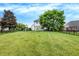 Large backyard with playground and a home visible in the background at 3828 Highland Park Dr, Greenwood, IN 46143