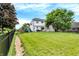 Landscaped backyard with a playset and a view of the house at 3828 Highland Park Dr, Greenwood, IN 46143