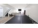 Finished basement features a ping pong table, stairs, and plenty of space for entertainment at 3828 Highland Park Dr, Greenwood, IN 46143