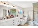 Elegant bathroom with double vanity, soaking tub, and walk-in shower at 3828 Highland Park Dr, Greenwood, IN 46143