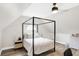 Cozy bedroom with a canopy bed, nightstands, and wood floors at 3828 Highland Park Dr, Greenwood, IN 46143