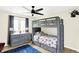 bedroom with a bunk bed, dresser, and blue rug at 3828 Highland Park Dr, Greenwood, IN 46143