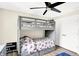 bedroom with a grey bunk bed and ample closet space at 3828 Highland Park Dr, Greenwood, IN 46143