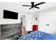Comfortable bedroom with dresser and TV at 3828 Highland Park Dr, Greenwood, IN 46143