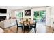 Round dining table with black chairs situated near sliding doors at 3828 Highland Park Dr, Greenwood, IN 46143