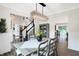 Spacious dining area with a farmhouse table and stylish lighting at 3828 Highland Park Dr, Greenwood, IN 46143
