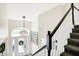 Bright and spacious entryway with a large chandelier and view of front door at 3828 Highland Park Dr, Greenwood, IN 46143