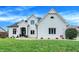 Stunning white brick home with a beautifully landscaped lawn at 3828 Highland Park Dr, Greenwood, IN 46143