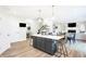 Open floor plan showing a kitchen with an island and a view into Gathering room at 3828 Highland Park Dr, Greenwood, IN 46143