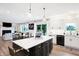 Modern kitchen with large island and white shaker cabinets at 3828 Highland Park Dr, Greenwood, IN 46143