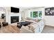 Living room with a cozy fireplace and large sectional sofa at 3828 Highland Park Dr, Greenwood, IN 46143