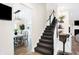 Elegant staircase with dark carpeting and a white railing at 3828 Highland Park Dr, Greenwood, IN 46143