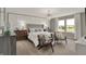 Relaxing bedroom with decorative wall, stylish furniture, and a large window with natural light at 5107 Maddox Ln, Whitestown, IN 46075