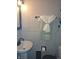 Simple bathroom with pedestal sink and updated fixtures at 515 Wedgewood Dr, Anderson, IN 46013
