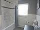 Modern bathroom with marble tile and new fixtures at 515 Wedgewood Dr, Anderson, IN 46013