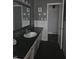 Bathroom with dark vanity and updated tile at 515 Wedgewood Dr, Anderson, IN 46013