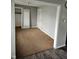 Bedroom features a walk-in closet and neutral walls ready for personalization at 515 Wedgewood Dr, Anderson, IN 46013