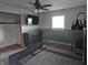 Bedroom with a ceiling fan and large TV at 515 Wedgewood Dr, Anderson, IN 46013