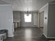 Spacious dining area with new flooring and light fixture at 515 Wedgewood Dr, Anderson, IN 46013