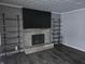 Stone fireplace with built-in shelves on either side at 515 Wedgewood Dr, Anderson, IN 46013