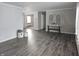 Open living room with gray walls and dark gray floors at 515 Wedgewood Dr, Anderson, IN 46013