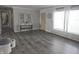 Living room with gray walls, dark floors, and entryway view at 515 Wedgewood Dr, Anderson, IN 46013