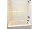 Clean bathroom with a bathtub and shower at 521 N Swain St, Ingalls, IN 46048