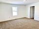 Large bedroom with new carpet and fresh paint at 521 N Swain St, Ingalls, IN 46048