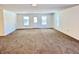 Bright living room featuring new carpet and fresh paint at 521 N Swain St, Ingalls, IN 46048