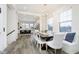 Bright dining room features a large table, bench seating, and hardwood floors at 559 Fulton St, Indianapolis, IN 46202