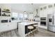 Modern white kitchen with marble island, stainless steel appliances at 559 Fulton St, Indianapolis, IN 46202