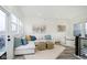 Relaxing living room with sectional sofa, neutral decor, and access to deck at 559 Fulton St, Indianapolis, IN 46202