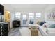 Open living space with sectional sofa, large windows, and a view of the city at 559 Fulton St, Indianapolis, IN 46202