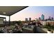 Rooftop deck with city views, seating and dining area at 559 Fulton St, Indianapolis, IN 46202