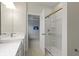 Bathroom with single vanity, shower, and access to bedroom at 6322 Loraine Dr, Brownsburg, IN 46112