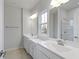 Double vanity bathroom with a large mirror and shower at 6322 Loraine Dr, Brownsburg, IN 46112