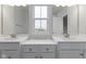 Double vanity bathroom with a large mirror and window at 6322 Loraine Dr, Brownsburg, IN 46112