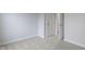 Well-lit bedroom with carpet flooring and access to hallway at 6322 Loraine Dr, Brownsburg, IN 46112