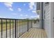 Private deck with wooden flooring and black railing, overlooking community at 6322 Loraine Dr, Brownsburg, IN 46112
