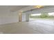 Unfinished two-car garage with open view to the outside at 6322 Loraine Dr, Brownsburg, IN 46112