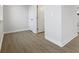Clean and spacious hallway with light wood flooring at 6322 Loraine Dr, Brownsburg, IN 46112