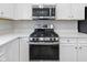 Stainless steel range and microwave in modern kitchen at 6322 Loraine Dr, Brownsburg, IN 46112