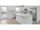 Modern kitchen with white cabinets and island at 6322 Loraine Dr, Brownsburg, IN 46112