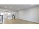 Open concept kitchen with white cabinets and a large island at 6322 Loraine Dr, Brownsburg, IN 46112