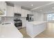 Modern kitchen with white cabinets and stainless steel appliances at 6322 Loraine Dr, Brownsburg, IN 46112